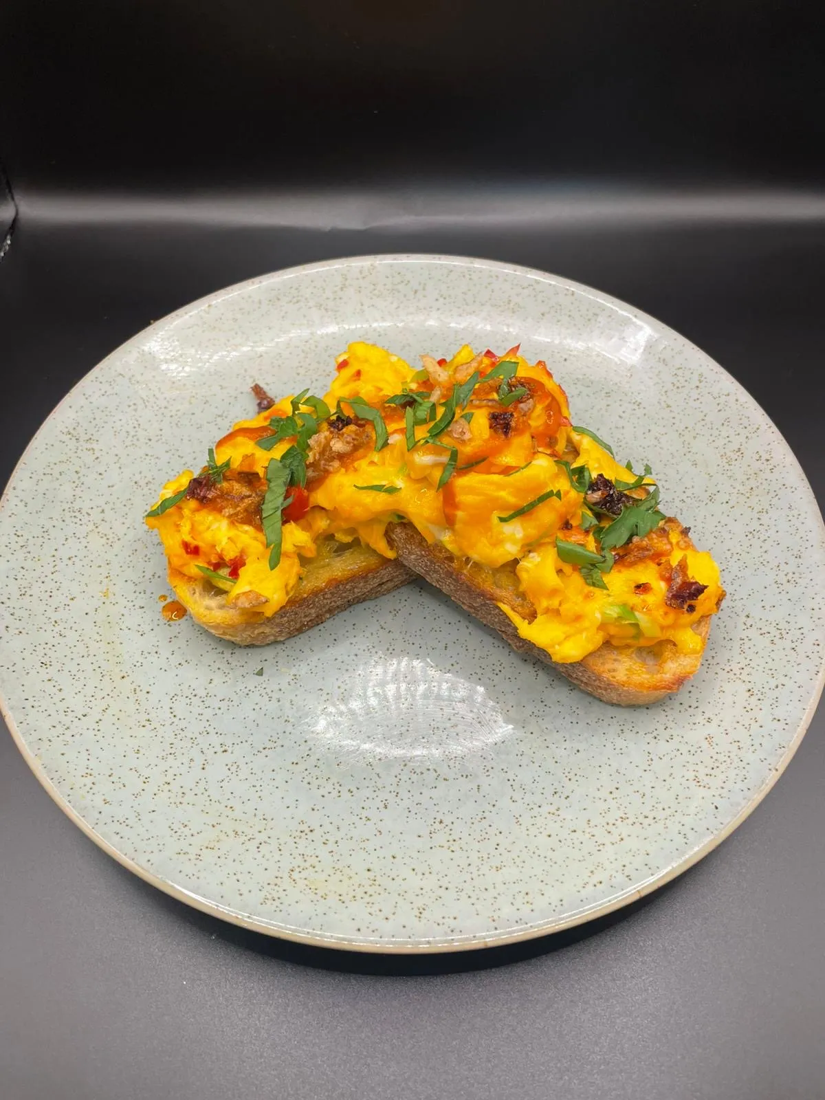 Deli or café product presented on a plate with dark background
